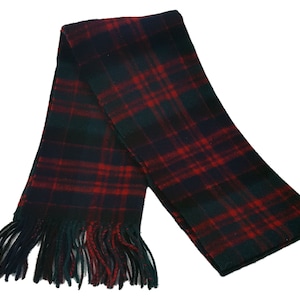 May include: A red, black, and green plaid scarf with fringed ends.