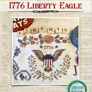 May include: A cross-stitch design featuring an American eagle with a shield, surrounded by floral elements. The design includes the text "1776" and "Liberty". The background is a parchment-like texture, with the words "We the People" visible.