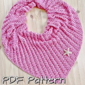 May include: A pink crochet shawl with a star-shaped embellishment. PDF Pattern.
