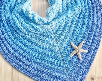 May include: A blue and white crochet shawl with a star-shaped design. The shawl is made with a gradient yarn that transitions from white to blue. The text "PDF Pattern" is visible at the bottom of the image.