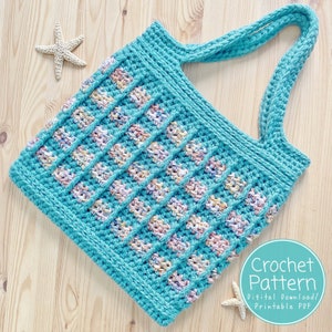 May include: A teal crochet tote bag with a colourful striped pattern. The bag has two long straps and is made with a textured yarn. Crochet Pattern Digital Download/Printable PDF.