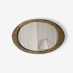 Late 20th century Art Nouveau oval mirror with hand-carved plaster frame