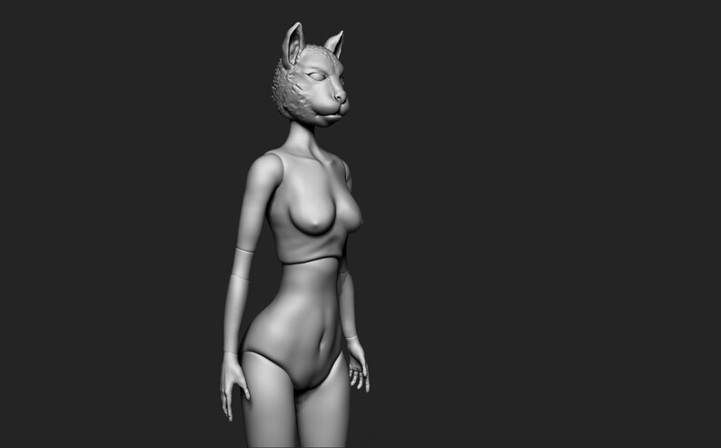 May include: A grey, sculpted figure of a woman with a cat head. The figure is wearing a simple, strapless top and a skirt.
