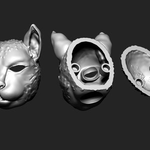 May include: A 3D printed model of a cat's head, shown in three views: front, back, and inside. The model is hollow and has a smooth, detailed surface.