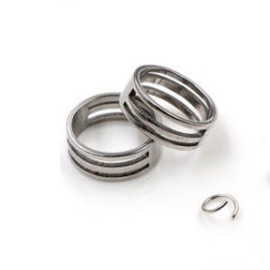 May include: Two silver jump rings and a pair of silver pliers on a white surface.