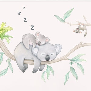 May include: A watercolor illustration of two koalas sleeping on a tree branch with green leaves. The koalas are gray and white, and the leaves are a light green. There are also two small birds and a ladybug on the branch. The illustration is on a white background.