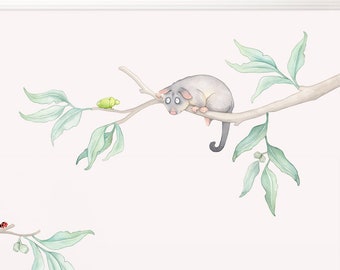 May include: A set of wall decals featuring a possum, a lizard, a ladybug, and leaves on branches. The decals are in a watercolor style and are perfect for a nursery or child's room.
