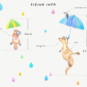 May include: A colorful illustration of a platypus holding an umbrella, a kangaroo holding an umbrella with a kookaburra perched on top, and a joey kangaroo inside. The platypus is 26 cm tall and the kangaroo is 57 cm tall.