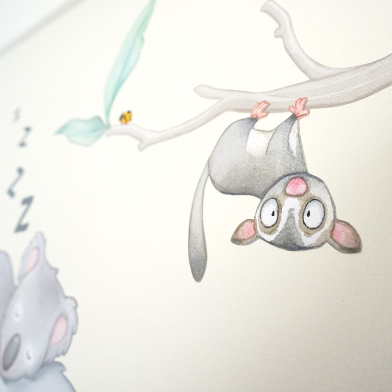 May include: A watercolor illustration of a gray sugar glider hanging upside down from a branch. The sugar glider has large, round eyes and a pink nose. The illustration is on a white background.