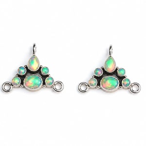 May include: Two silver-toned jewelry connectors, each featuring a triangular arrangement of iridescent, oval and round cabochon opals. Each piece includes a central horizontal oval opal, four smaller round opals, one pear-shaped opal, and three loops.