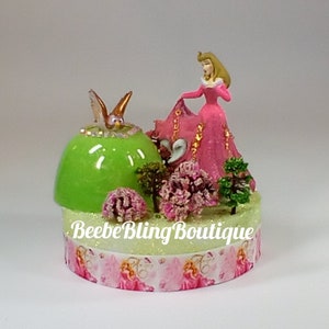 Disney Princess Aurora and her owl friend cake topper.  Disney Sleeping Beauty centerpiece.