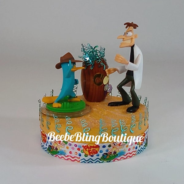 Disney Phineas and Ferb cake topper.  Dr. Doofenshmirtz and Perry centerpiece decoration.  A great keepsake for your memories.