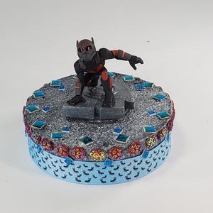Disney Ant man cake topper.  Ant man centerpiece decoration.  A great keepsake for your memories.  Not fondant!