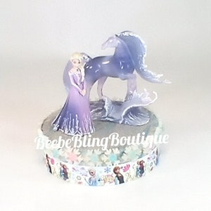 Disney Elsa and Nokk  the water horse cake topper.  Frozen centerpiece decoration.  A great keepsake for your memories.
