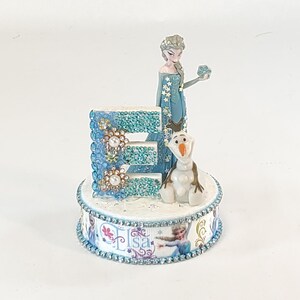 Disney Elsa cake topper.  Frozen centerpiece decoration.  A great keepsake for your memories.