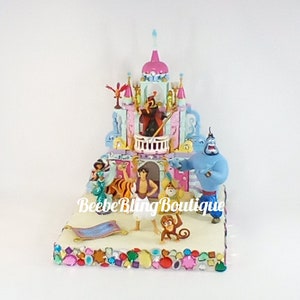 Disney Aladdin large cake topper.  Aladdin, Aboo, Genie, Sulton, Jasmie, Rajah, Jafar, and Yargo centerpiece decoration.  A great keepsake.