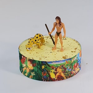 Disney Tarzan cake topper.  Tarzan centerpiece decoration.  A great keepsake for your memories.  Not fondant!