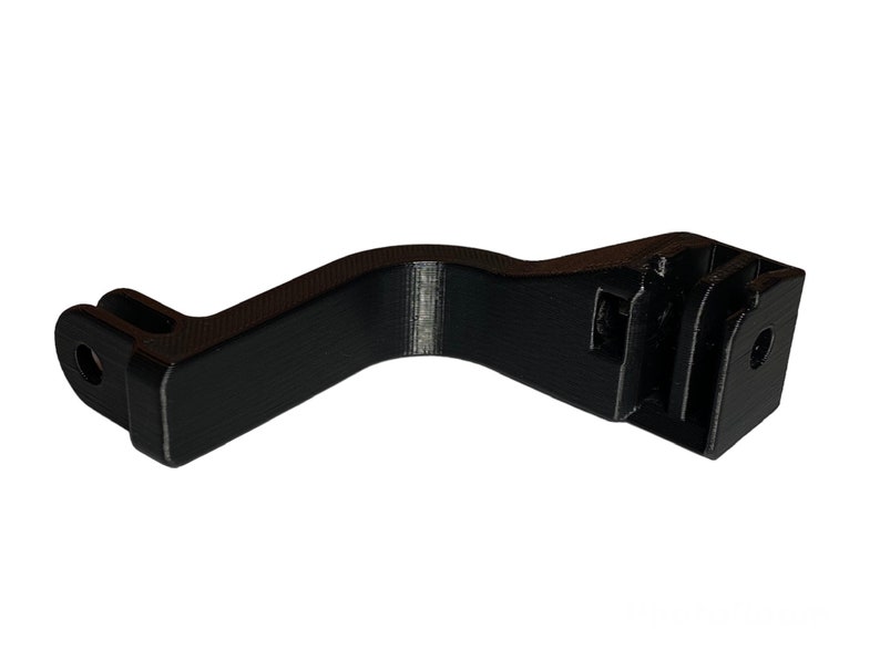 May include: Black plastic GoPro mount with a curved arm and a standard GoPro mount on the end.