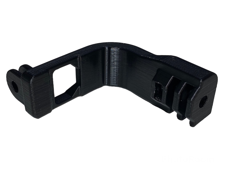 May include: Black plastic 3D printed adapter with a GoPro mount on one end and a square opening on the other end.