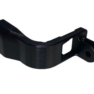 May include: Black 3D printed GoPro mount with a curved arm and a standard GoPro mount on the end.
