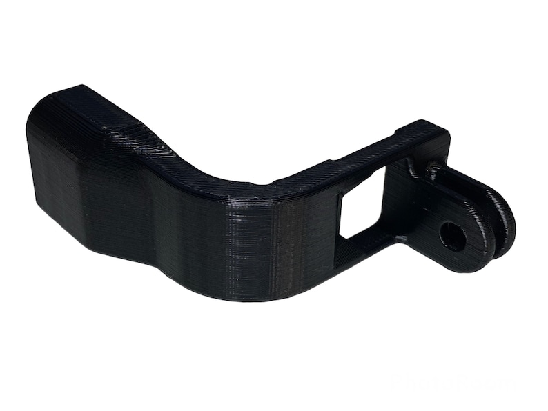May include: Black 3D printed GoPro mount with a curved arm and a standard GoPro mount on the end.