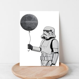 May include: A black and white illustration of a Stormtrooper holding a Death Star balloon. The Stormtrooper is wearing white armor and a helmet. The Death Star balloon is gray and detailed. The image is on a white background.