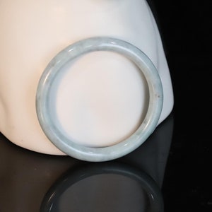 Authentic Thin Burmese Ligth Green Jadeite Bangle: Timeless Elegance.