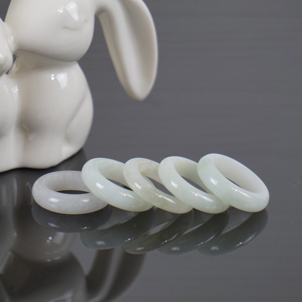 Genuine white Jade ring in white base with not limited to some part of other light colors for any gender such as woman and man.