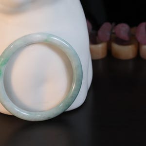 Elegant large thin jade bangle, crafted from authentic jadeite. The timeless beauty and luxury.