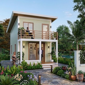 May include: A two-storey house with a pale green exterior, a white balcony, and a brown roof. The house features large windows and a wooden balcony railing. The garden is landscaped with lush greenery, flowers, and a stone pathway.