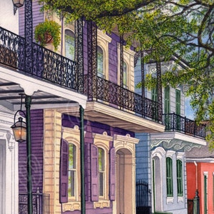 May include: A watercolor painting of a row of colorful houses with ornate iron balconies and railings. The houses are lined up on a street with a tree canopy overhead. The houses are painted in shades of purple, yellow, blue, and red.