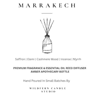 May include: An amber apothecary bottle reed diffuser with reeds, illustrated in black ink on a white background. The text "MARRAKECH" is at the top, with fragrance notes and product details below. The words "WILDFERN CANDLE STUDIO" are at the bottom.