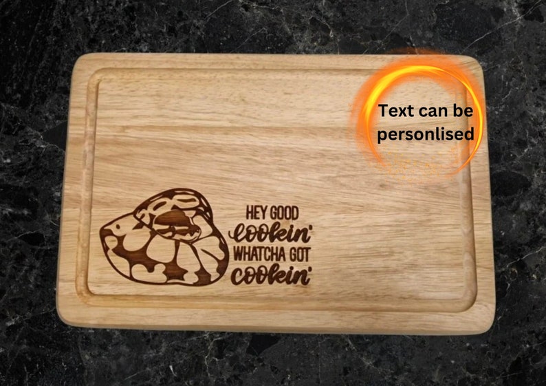 30cm x 20cm hevea wood chopping board, lasered with a picture of a ball python / royal python.