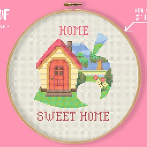 May include: Cross stitch pattern for an 8-inch hoop featuring a house with a red door and a green leaf with the words "Home" and "Sweet Home" in pink.