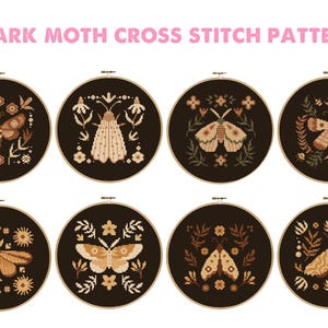 May include: Eight dark moth cross stitch patterns displayed in embroidery hoops. Each pattern features a moth design in shades of brown and beige, surrounded by floral and leaf motifs, set against a dark brown background.