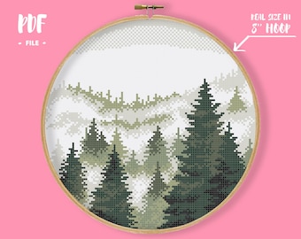 May include: A cross-stitch pattern PDF file featuring a pixelated forest landscape with layered pine trees in shades of dark and light green. The design is displayed within a wooden embroidery hoop, with text indicating a real size in an 8 inch hoop.