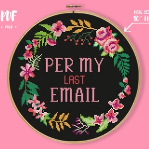May include: A black and white cross-stitch pattern with a floral wreath and the text "Per My Last Email" in pink. The pattern is designed for a 10-inch embroidery hoop.