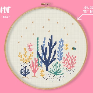 May include: A cross-stitch pattern of a colorful underwater scene with coral, seaweed, and a small yellow fish. The pattern is designed to fit in a 10-inch embroidery hoop. PDF file.