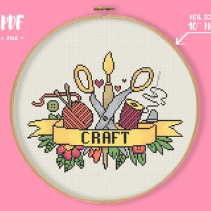 May include: A cross-stitch pattern featuring a variety of crafting tools, including scissors, yarn, needles, and thread. The tools are arranged around a banner that reads "CRAFT". The pattern is designed for a 10-inch hoop.