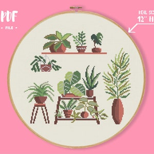 May include: Cross stitch pattern featuring a collection of potted plants in various shades of green, brown, and terracotta. The pattern is designed to fit a 12-inch hoop.