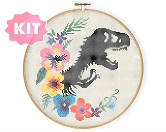 May include: A cross-stitch pattern kit featuring a black silhouette of a dinosaur surrounded by colorful flowers. The kit includes all the materials needed to complete the project.