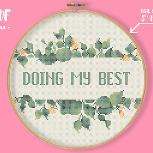 May include: A cross-stitch pattern in an 8-inch hoop with a green leafy border and the text "Doing My Best".