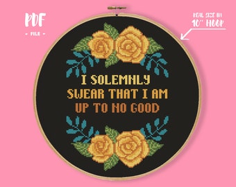 May include: A black embroidery hoop with a cross-stitch design featuring yellow roses, green leaves, and the text "I solemnly swear that I am up to no good". The hoop is 10 inches in diameter.