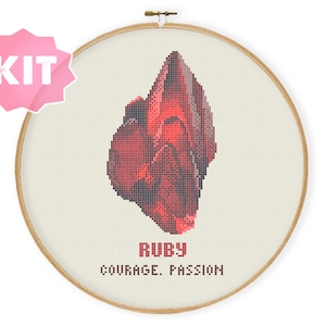 May include: Cross stitch pattern kit featuring a red ruby gemstone with the text "RUBY COURAGE. PASSION"