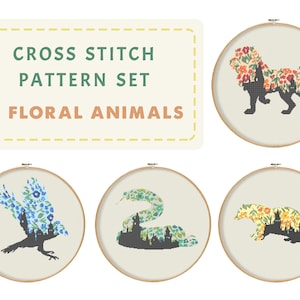 Op de afbeelding: Set van vier kruissteekpatronen met bloemdieren. Elk patroon toont een ander dier, waaronder een leeuw, een vogel, een slang en een das, met een bloemmotief dat in het silhouet van het dier is verwerkt.