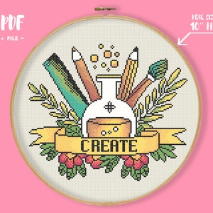 May include: Cross-stitch design in a wooden embroidery hoop. The design features art supplies like pencils, a ruler, and a paintbrush surrounding a flask. A banner with the word "CREATE" is at the bottom. The text "PDF FILE" is at the top left. The hoop is 10 inches in diameter.