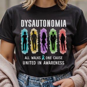 May include: Black t-shirt with the word "DYSAUTONOMIA" in white. Below the word are six silhouettes in colourful frames. The text "ALL WALKS ONE CAUSE UNITED IN AWARENESS" is below the silhouettes.