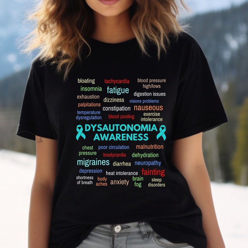 Dysautonomia Awareness Shirt, offered in black only. Many of the symptoms that are related to dysautonomia are listed in vibrant colors on the front of shirt.