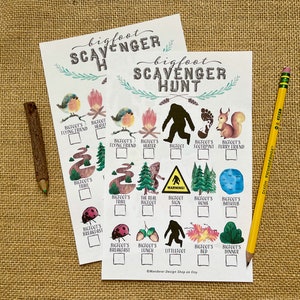 May include: Two printable Bigfoot Scavenger Hunt game cards with a checklist of items to find. The cards feature illustrations of a Bigfoot, a campfire, a footprint, a squirrel, a ladybug, a tree, a warning sign, a home, a bathtub, acorns, a bed, and a dinner plate.