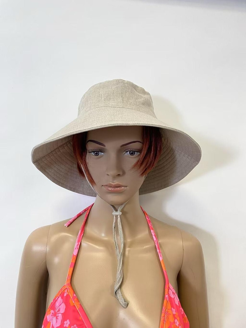 natural linen wide brim hat on mannequin